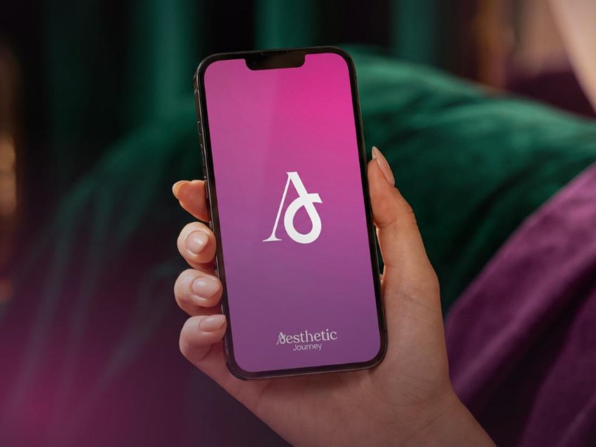 Aesthetic Journey app on iPhone — woman holding phone